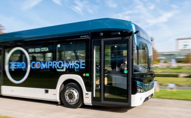 A bus is driving through Sommergarten at Messe Berlin.