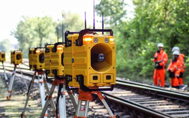 Automatic light and sound warning system provides warning of approaching trains 
